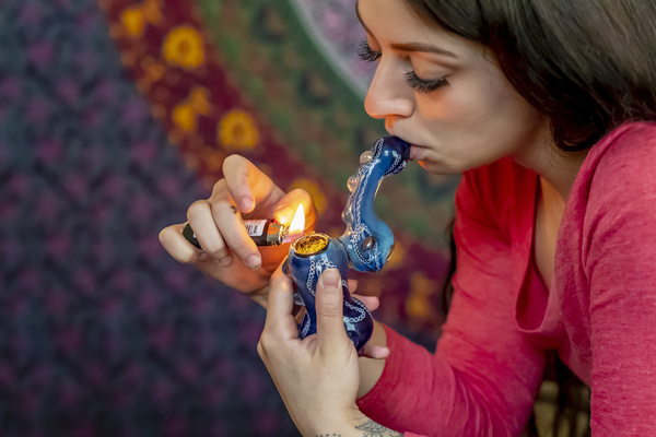 Beautiful Brunette Female Model Smoking Marijuana girl smoking herbal blend